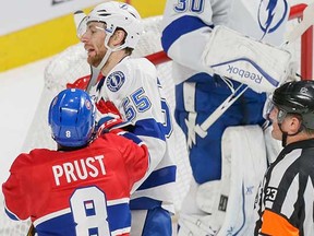 Montreal Canadiens winger Brandon Prust pushes Tampa Bay Lightning defenceman Braydon Coburn while referee Brad Watson looks on during Game 2 of their NHL Eastern Conference semifinal series on Sunday at the Bell Centre in Montreal. (Dario Ayala, Postmedia News)