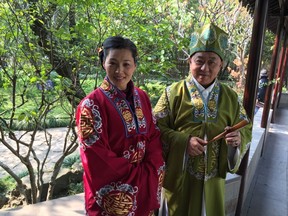 Locals in tradition costume in Lingering Garden in Suzhou