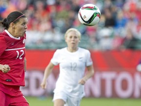 Canada's Christine Sinclair (12) vies for the ball as New Zealand's Betsy Hassett (12) defends during second half action at FIFA World Cup in Edmonton, Alta., on Thursday June 11, 2015. Sinclair is confident the goals are coming.Canada's women's soccer team has scored just once in its first two group-stage matches at the FIFA Women's World Cup.