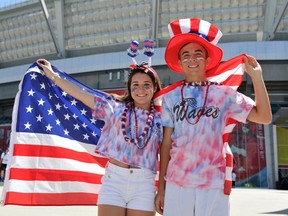 Emily Fichera and Trevor Fournier, who traveled from Florida to cheer for the the United States, pose in front of BC Place Stadium to watch the USA take on Nigeria in the Group D match of the FIFA Women's World Cup Canada 2015 on June 16, 2015 in Vancouver, Canada.