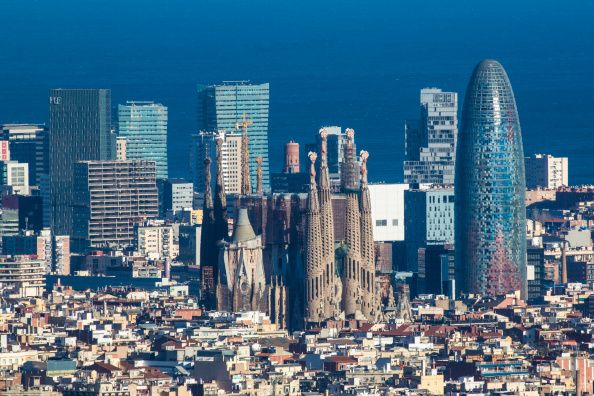 Europe, Spain, Catalunya Region, Barcelona City, View of city with Agbar tower and Sagrada Familia Cathedral. (Photo by: JTB Photo/UIG via Getty Images)