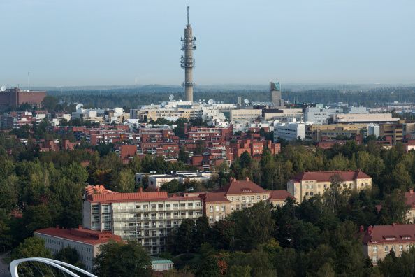 Residential apartment blocks stand on the city skyline beneath a telecommunications tower in Helsinki, Finland, on Friday, Sept. 19, 2014. Finland can't afford to be stripped of its AAA credit rating and will make the adjustments needed to keep rating companies and investors happy, Economy Minister Jan Vapaavuori said. Photographer: Tomi Setala/Bloomberg via Getty Images