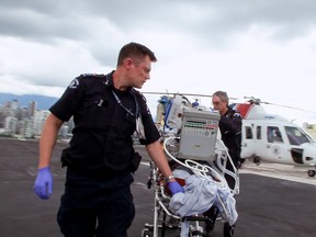 Paramedics land on the roof of Vancouver General Hospital with a patient, a scene from the Knowledge Networks's first season of Emergency Room: Life and Death at VGH.
