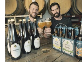 Adam Mills, left, and Brent Mills with some of their award-winning beers. Four Winds was named 2015 Brewery of the Year at the Canadian Brewing Awards earlier this month.
