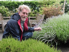 Sculptor Doug Taylor with small working model of his larger Nautilus design