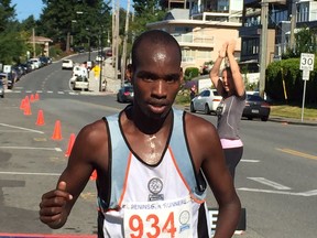 Benard Ngeno of Surrey crosses the finish line on Sunday after winning the Sandcastle City Classic 10K by more than four minutes. He clocked a 32:32 time on the hilly and challenging course.