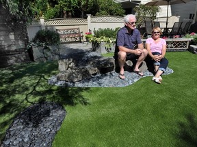 Cherie and Stuart Corrigal with their new raccoon-proof artificial lawn