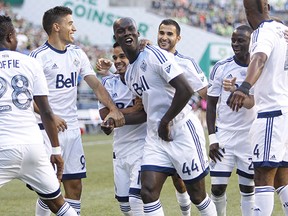 Aug 1, 2015; Seattle, WA, USA; Vancouver Whitecaps defender Pa-Modou Kah (44) celebrates with teammates after scoring a goal against the Seattle Sounders FC during the first half at CenturyLink Field. Mandatory Credit: Joe Nicholson-USA TODAY Sports