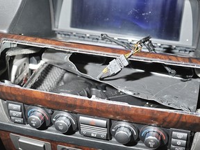 Gun in secret compartment of Matin Pouyan's vehicle on Dec. 22, 2009