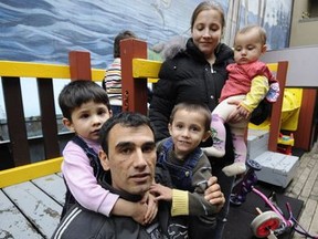 'We are in the middle of a quiet demographic revolution. It's just sneaking up on people,' says Edmonds Community School principal David Starr of the rising numbers of refugees in the region. PHOTO: A refugee family from Iran -- father Masoud Ahmadi, mother Ana Mironava and their kids, 8-month-old Darya, Michael, 4, and Pavel, 3.