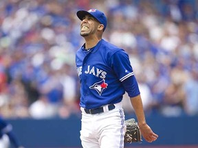Toronto Blue Jays starting pitcher David Price grimaces during his Jays’ debut, a victory, against the Minnesota Twins in Toronto on Monday. (Fred Thornhill, Canadian Press)