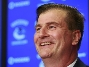 VANCOUVER, BC - MAY 23:  Vancouver Canucks new General Manager smiles during a press conference at Rogers Arena May 23, 2014 in Vancouver, British Columbia, Canada.   (Photo by Jeff Vinnick/NHLI via Getty Images)