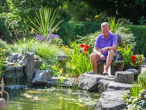 Don siemens beside his pool in his Langley garden