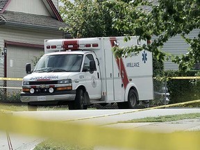 Ambulance outside murder victim's home on Promontory Court Thursday