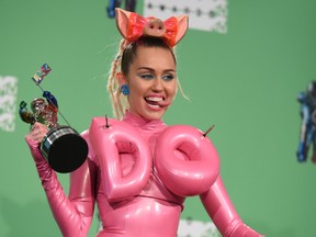Miley Cyrus poses in the press room at the MTV Video Music Awards at the Microsoft Theater on Sunday, Aug. 30, 2015, in Los Angeles. Cyrus recently took aim at a B.C. government program aimed a culling wolves in caribou territory.