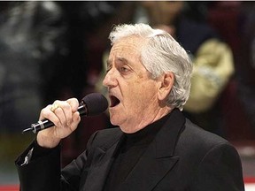 Richard Loney sings the U.S. and Canadian anthems prior to the Vancouver Canucks hosting the Washington Capitals in a March 2003 National Hockey League game at GM Place. (Ric Ernst, PNG files)