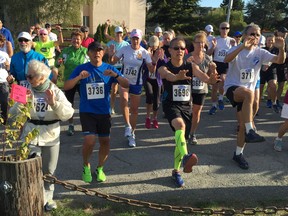 More than 200 people in Sunday's inaugural Forever Young 8K race in Richmond warm up before the start of the run/walk event at Garry Point Park. The sold-out event was for people 55 years of age and older and included former Olympians and current world record holders.
