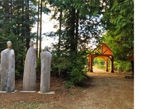 The Ancestors, wooden sculptures donated by Denman Island sculptor Michael Dennis for the Denman Island Natural Burial Cemetery. They are placed just outside the main entrance of the cemetery.