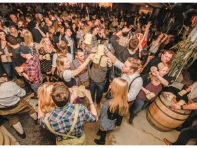 Harvest Haus revellers raise their steins.