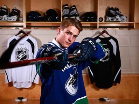 Jake Virtanen strikes a pose in June 2014, after he was selected sixth overall in that year's NHL Entry Draft by the Vancouver Canucks. (Jeff Vinnick, NHLI via Getty Images)