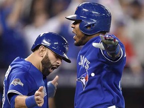 Sluggers Jose Bautista (left) and Edwin Encarnacion will both be on the final year of their current contracts with the Toronto Blue Jays in 2016, so striving for a title next season is imperative. (Frank Gunn, Canadian Press)