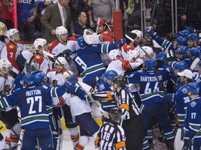 A bench-clearing shoving match breaks out following the Vancouver Canucks overtime win over the Florida Panthers in Vancouver, B.C. Monday, Jan.11, 2016. THE CANADIAN PRESS