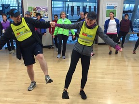 Walnut Grove InTraining leader Arian Soheili dances with Tracy Klee-Hunt during Sunday morning's fun warm-up. The 13-week program, designed to get runners and walkers ready for the 32 annual Sun Run on April 17, launched around the province on the weekend.