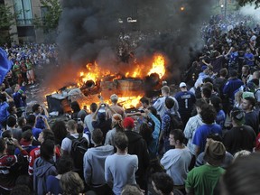 Hockey fans riot after game 7 of the Stanley Cup finals between the Canucks and the Boston Bruins in Vancouver, BC Wednesday, June 15, 2011. (Photo by Jason Payne/ PNG