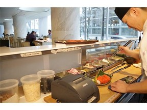 Sushi chef Taka Omi prepares sushi at the Vancouver Fairmont Pacific Rim
Photograph by: Francis Georgian, Vancouver Sun