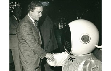 Bill Bennett greets Expo Ernie, the mascot for Expo 86.