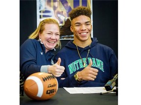 Abbotsford seconday school Panther Chase Claypool after signing his National Letter of Intent to attend and play football for the University of Notre Dame, flanked by his mother Jasmine Claypool (left) and his high school coach Jay Fujimura (right), on Wednesday, Feb. 3, 2016.