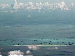 An aerial photo shows China’s efforts to fill in Mischief Reef to create land in the Spratly Islands in the South China Sea.