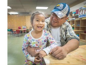 Allan Williams with 5-year-old daughter Autumn-rain inside Strathcona Community Centre.