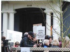 Anti-demolition protesters attend a rally outside 6088 Adera St in Vancouver, February 7, 2016.