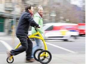 Barbara Alink rides her invention, the Alinker.