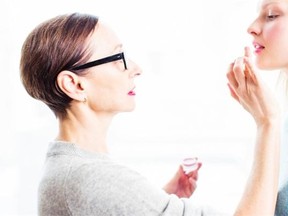 Beauty guru Rose-Marie Swift applies makeup to a model. One product you won’t ever see come from RMS Beauty is silicone and talc-stuffed mineral powder.