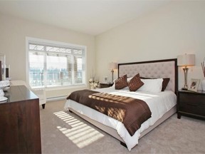 Bedrooms and closets are carpeted, while flooring in the entries, kitchens and dining and living rooms is laminate.