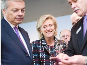 Belgium’s Princess Astrid, middle, visits the Vancouver Aquarium in Vancouver Monday with Didier Reynders, left, the Belgian Deputy Prime Minister and Minister of Foreign Affairs and European Affairs, and John Nightingale, right, president and CEO of the Vancouver Aquarium.