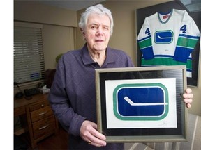 Joe Borovich holds an original Vancouver Canucks logo at his home in West Vancouver. Borovich created the logo in 1970 while living near Pacific Coliseum. His design beat out dozens sent in from around the globe.