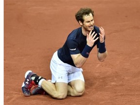 Britain’s Andy Murray reacts after winning his tennis match against Belgium’s David Goffin to win the Davis Cup final between Belgium and Britain at Flanders Expo in Ghent on November 29, 2015. Britain won the Davis Cup for the first time in 79 years in Ghent on Sunday when Andy Murray defeated David Goffin 6-3, 7-5, 6-3, in the first of the reverse singles for an unbeatable 3-1 lead over Belgium.