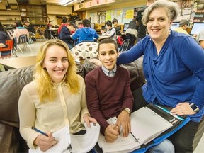 Britannia Homework Club students Megan Pakkala and Muhaned Shalash with Kim Leary, director of the Youth Engagement Program at Britannia Secondary in Vancouver.