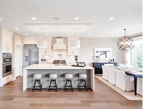 The Westcoast light wood tones in the kitchen of the display suite for the Brookmere development by Onni at 3355 North Road.