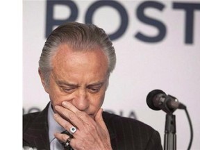 Paul Godfrey, chief executive of Postmedia Network Canada Corp., announced the merging of newsrooms in Ottawa, Calgary, Edmonton and Vancouver amidst a cost-cutting effort for the media chain.