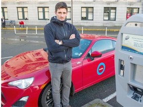 Sylvin Celaire with a Modo car outside the Pacific Central Station in Vancouver where new parking meters are issuing tickets even for a brief stop.