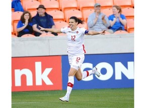 Canada’s Christine Sinclair (12) celebrates after scoring a goal against Costa Rica during the first half of a CONCACAF Olympic women’s soccer qualifying championship semifinal Friday, Feb. 19, 2016, in Houston.