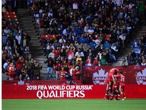 Canada’s Will Johnson is mobbed by his teammates after scoring against Honduras during the first half of their CONCACAF 2018 World Cup qualifying soccer match at BC Place Stadium on Nov. 13, 2015, a match Canada won 1-0. BC Place will again play host to a World Cup qualifier, this one against No. 22-world ranked Mexico, on March 25, 2016.