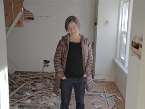 Caroline Adderson standing in the interior of a west-side Vancouver heritage house about to be demolished.