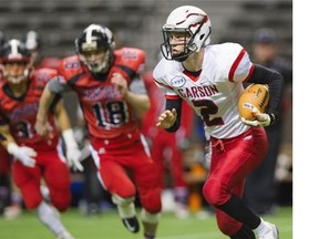 Carson Graham Eagles #2 Tyler Nylander scrambles with the ball during a play against the Abbotsford Panthers  in the AA Senior Varsity Championship football final at BC Place, Vancouver December 05 2015.