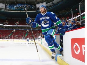Christopher Tanev #8 of the Vancouver Canucks steps onto the ice during their NHL game against the Tampa Bay Lightning at Rogers Arena January 9, 2016 in Vancouver, British Columbia, Canada.