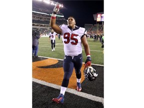 Christian Covington #95 of the Houston Texans celebrates as he walks off of the field after defeating the Cincinnati Bengals 10-6 at Paul Brown Stadium on November 16, 2015 in Cincinnati, Ohio.